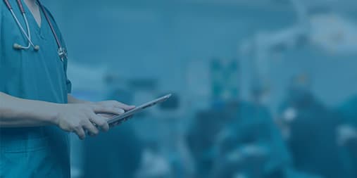 Clinician using a tablet in an operating room